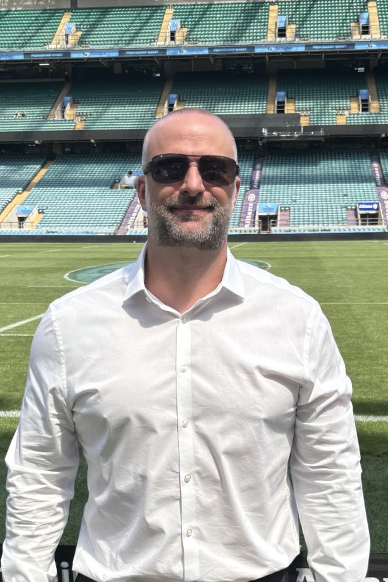 Portrait of Gareth Rose, founder of Rose Lock Property Ltd, standing in front of a stadium.